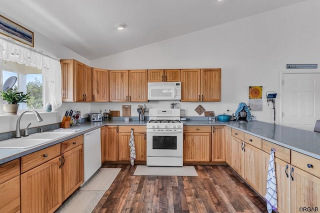 kitchen with sink, vaulted ceiling, dark hardwood / wood-style flooring, kitchen peninsula, and white appliances