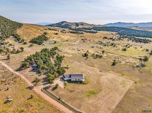 aerial view featuring a rural view and a mountain view