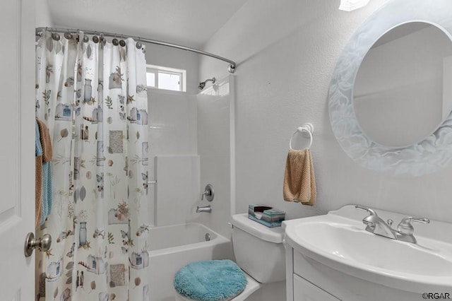 full bathroom featuring vanity, shower / tub combo, and toilet