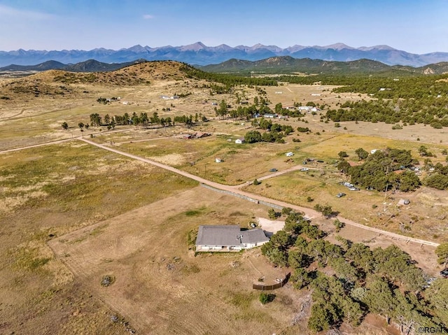 bird's eye view featuring a mountain view and a rural view