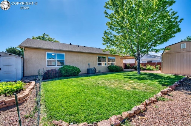 355 Antero Dr, Canon City, CO 81212 - back of house with a shed and stucco siding