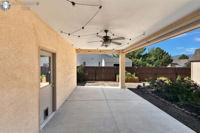 355 Antero Dr, Canon City, CO 81212 - fenced backyard with a ceiling fan and a patio area