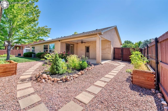 355 Antero Dr, Canon City, CO 81212 - view of front facade featuring ceiling fan, stucco siding, a fenced backyard, a patio area, and a gate