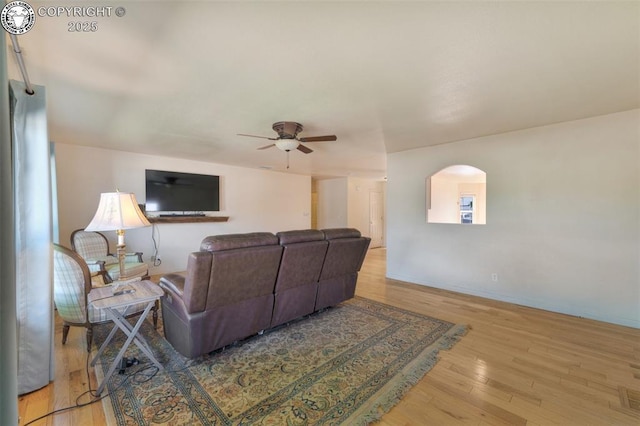 355 Antero Dr, Canon City, CO 81212 - living room featuring arched walkways, wood finished floors, and ceiling fan