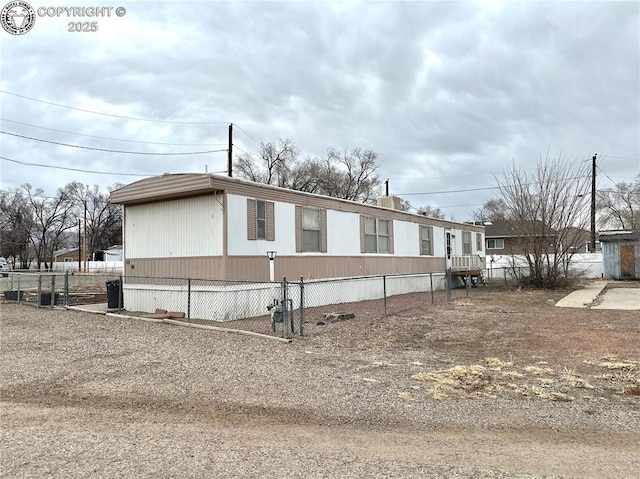 view of front of home featuring fence