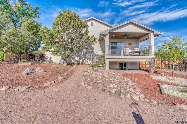 back of house featuring ceiling fan