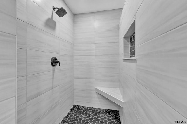 bathroom featuring tiled shower