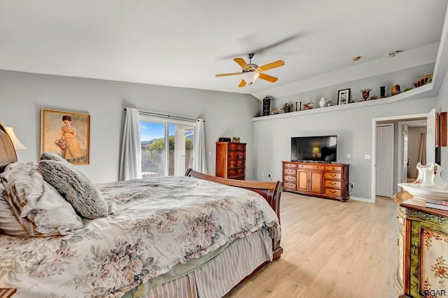 bedroom with light hardwood / wood-style flooring, ceiling fan, and vaulted ceiling