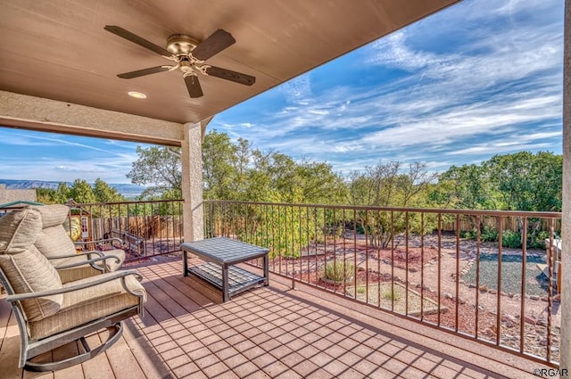 wooden terrace featuring ceiling fan