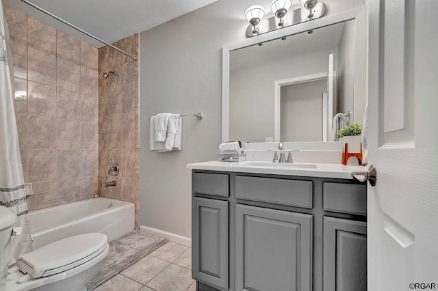 full bathroom with shower / bath combo with shower curtain, tile patterned floors, toilet, and vanity