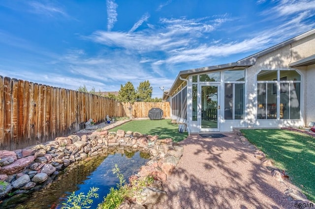 view of yard with a sunroom