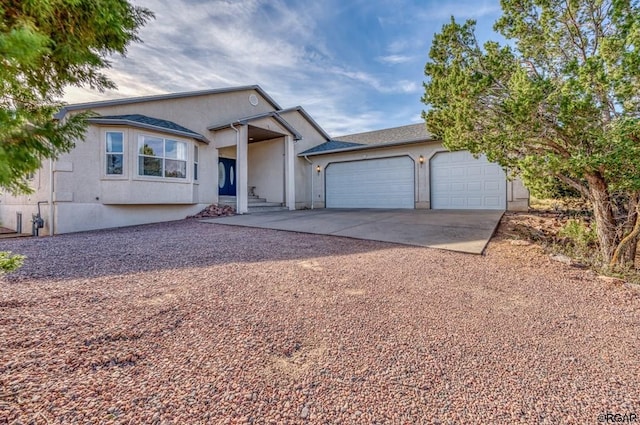 ranch-style house featuring a garage