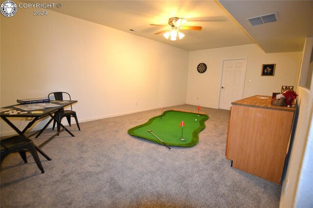 recreation room featuring carpet, golf simulator, and ceiling fan