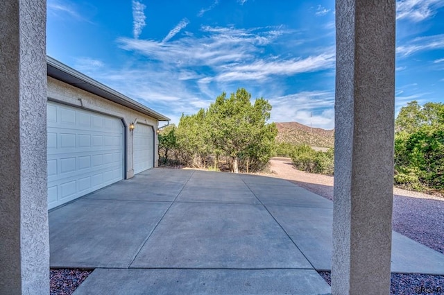 garage featuring a mountain view