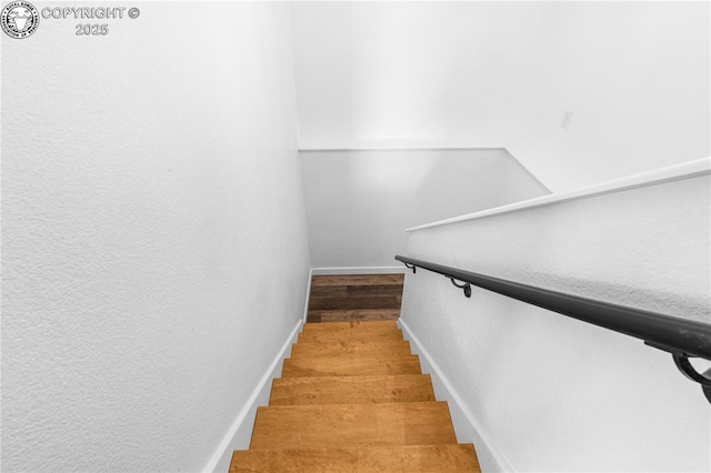 staircase featuring hardwood / wood-style flooring