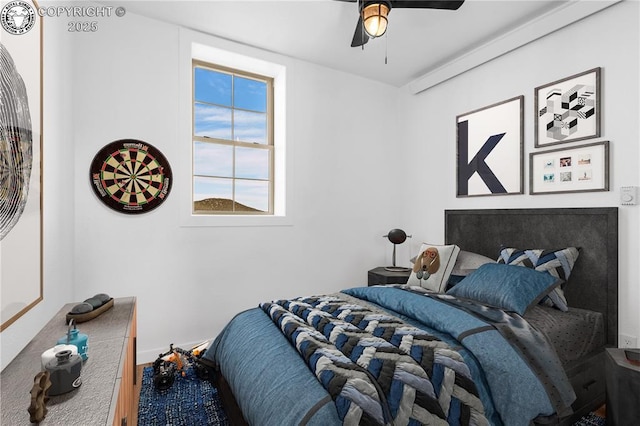 bedroom with hardwood / wood-style floors and ceiling fan