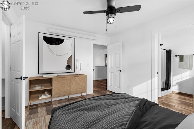 bedroom with dark wood-type flooring and ceiling fan