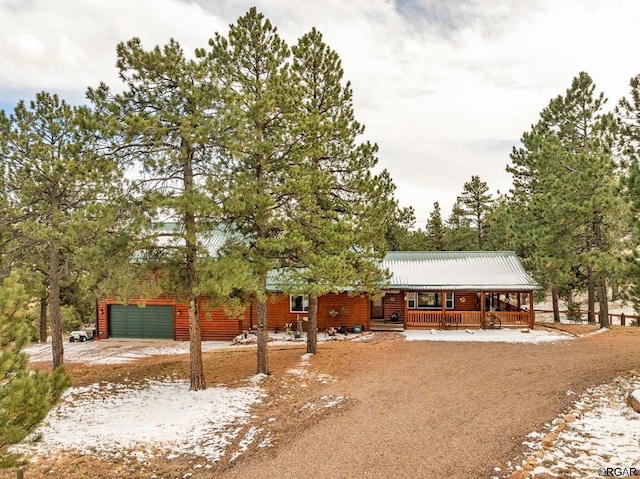 view of front of home with a garage and covered porch