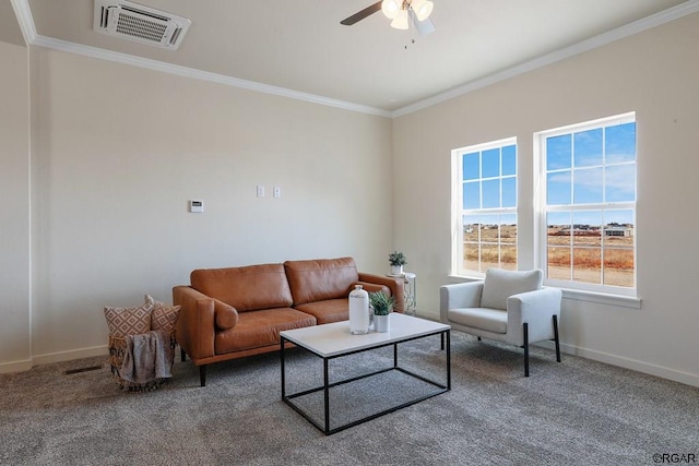 living room with ceiling fan, ornamental molding, and carpet flooring