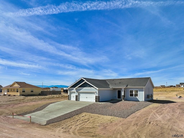 single story home with a garage