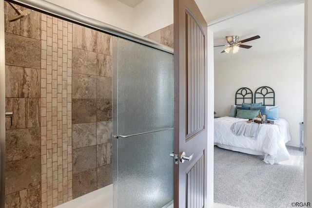 bathroom with an enclosed shower and ceiling fan