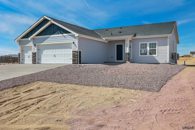 view of front of property with cooling unit and a garage