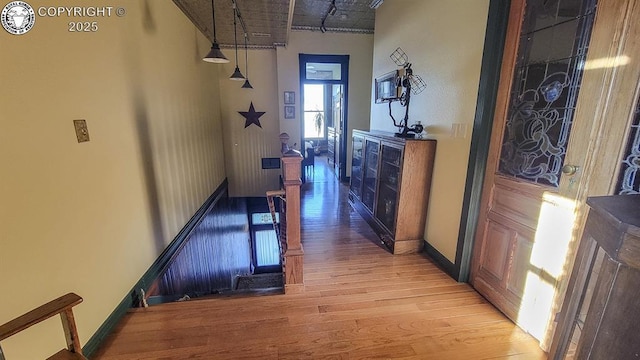 120 E Main St, Florence, CO 81226 - corridor with baseboards and light wood finished floors