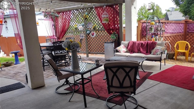 view of patio with outdoor dining space, fence, an outdoor living space, and a pergola