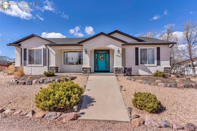 ranch-style home with stucco siding and stone siding