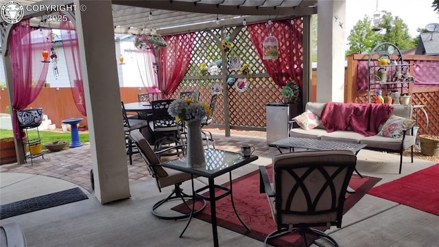 view of patio / terrace featuring outdoor dining space, outdoor lounge area, fence, and a pergola