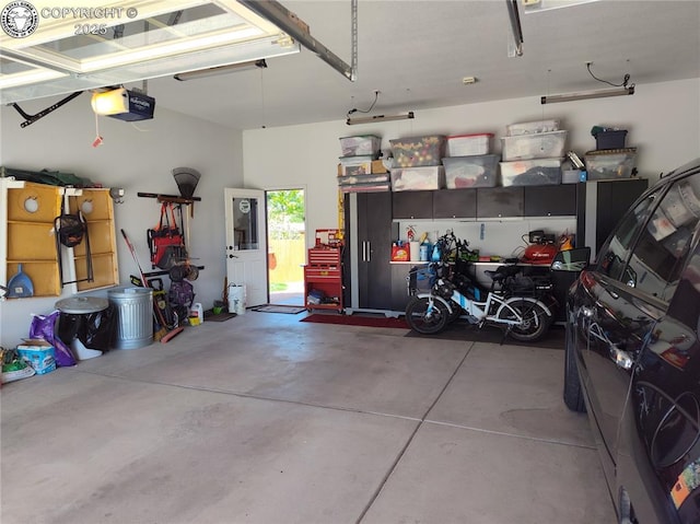 garage featuring a garage door opener