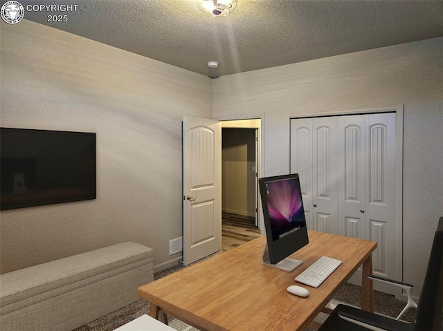 office area featuring a textured ceiling