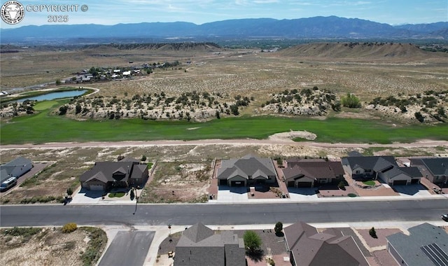 drone / aerial view featuring a mountain view