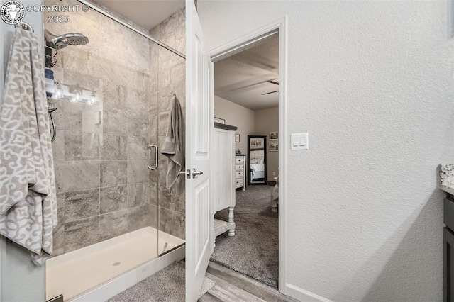 bathroom with vanity and an enclosed shower