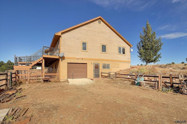 back of house featuring a garage