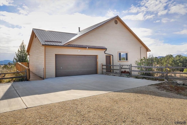 view of side of home with a garage