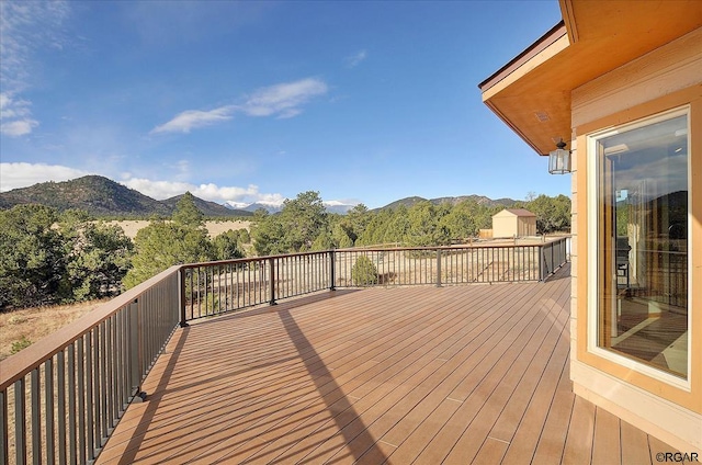 wooden terrace featuring a mountain view