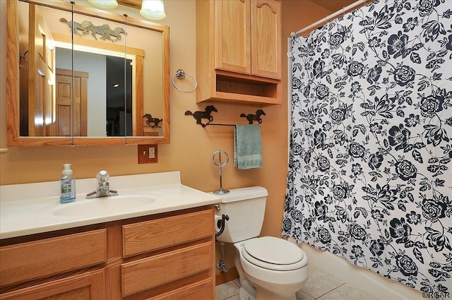 bathroom featuring vanity, curtained shower, tile patterned floors, and toilet