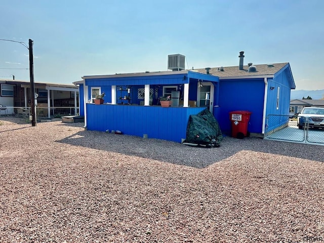 view of front of home featuring cooling unit