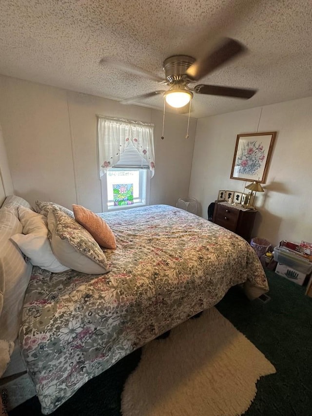 bedroom featuring a textured ceiling and ceiling fan