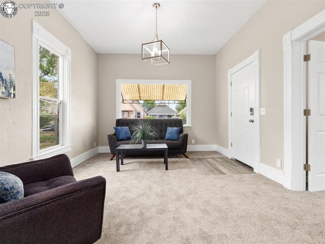 932 Elm St, Pueblo, CO 81004 - living area featuring plenty of natural light, carpet, and a chandelier