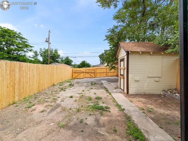 932 Elm St, Pueblo, CO 81004 - fenced backyard with an outbuilding