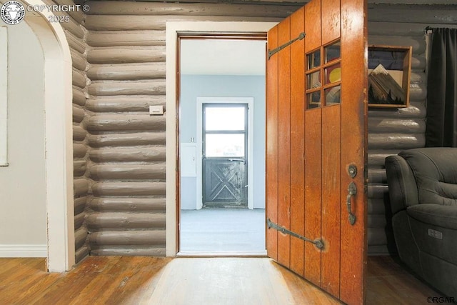 hall with light hardwood / wood-style flooring