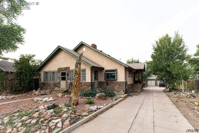 view of front facade with a garage and an outdoor structure