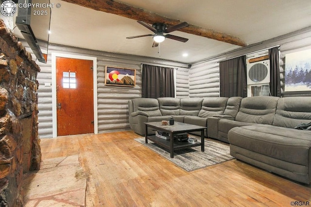 living room with ceiling fan, hardwood / wood-style floors, and beam ceiling