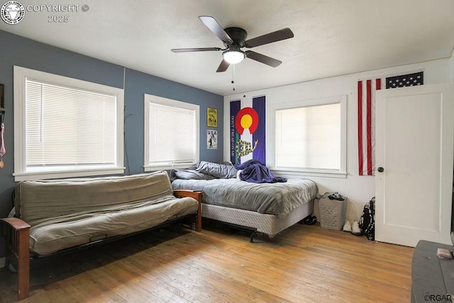 bedroom featuring ceiling fan and light hardwood / wood-style floors