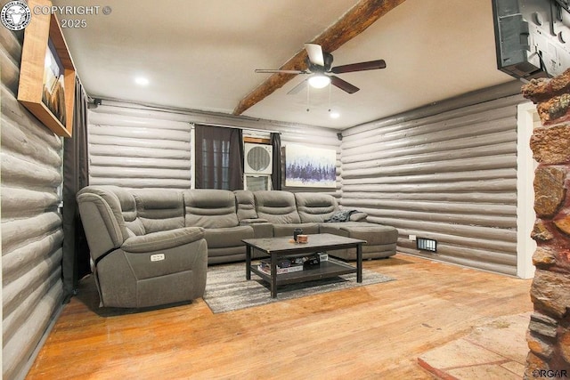 living room with wood-type flooring, ceiling fan, and beam ceiling