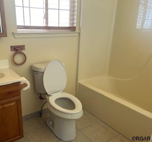 full bathroom featuring tile patterned flooring, vanity, shower / bathtub combination, and toilet