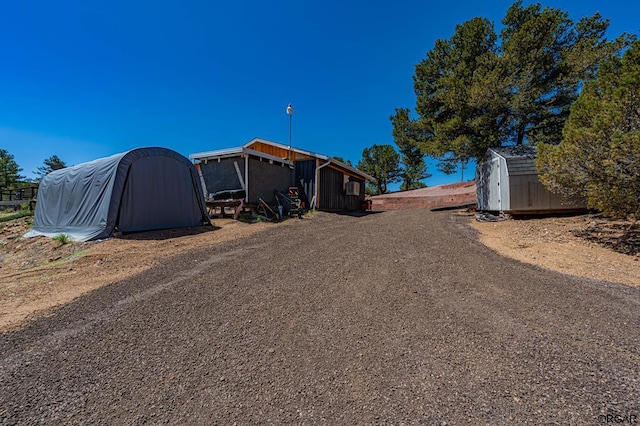 exterior space featuring a storage unit