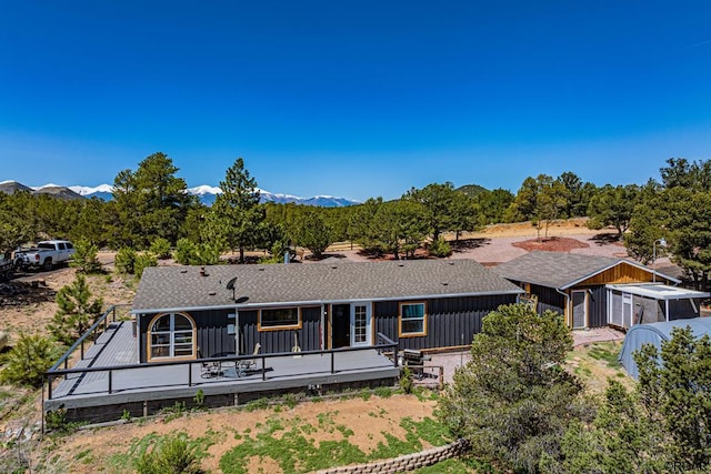 rear view of property with a mountain view